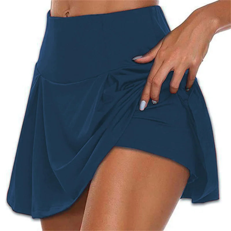 Women navy blue high waisted mini skirt with front pleats and integrated shorts active side view
