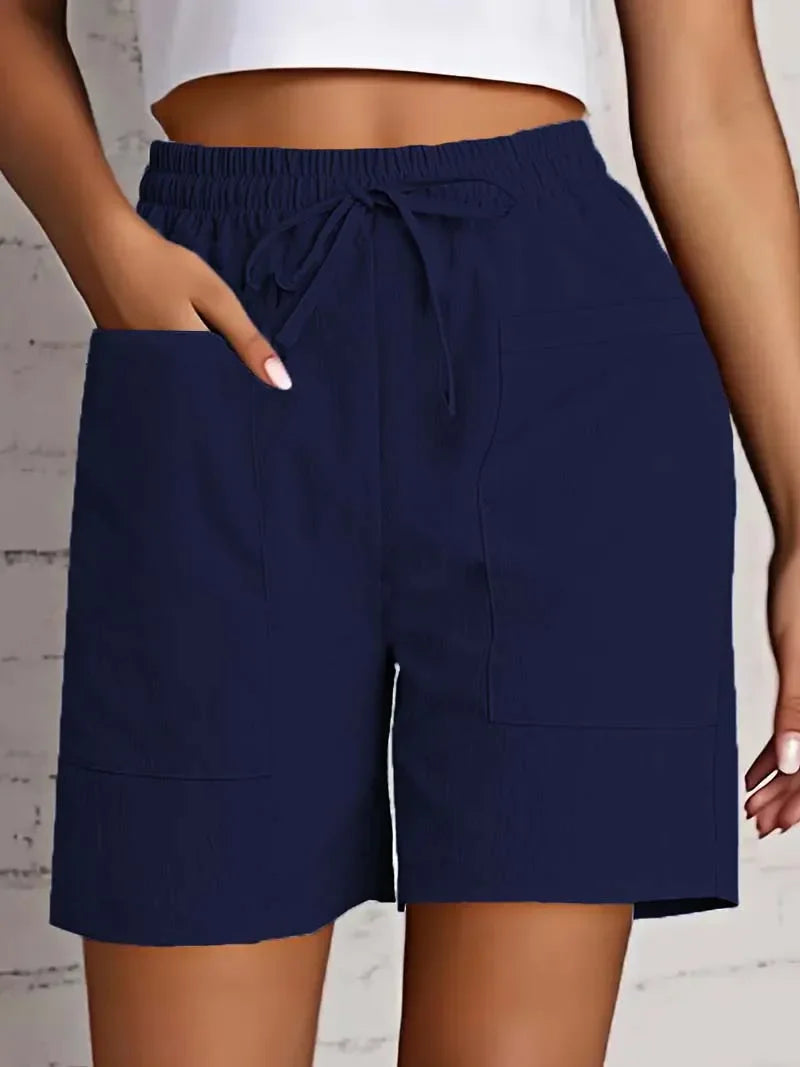 Women navy casual shorts with elastic waist and visible drawstring, featuring two large front patch pockets.