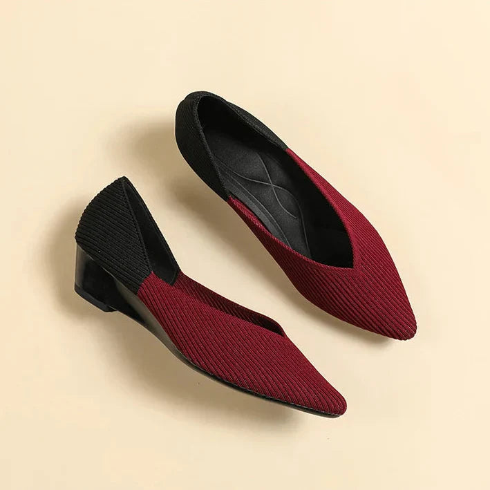 Women burgundy and black colorblock pointed toe wedge pumps side by side
