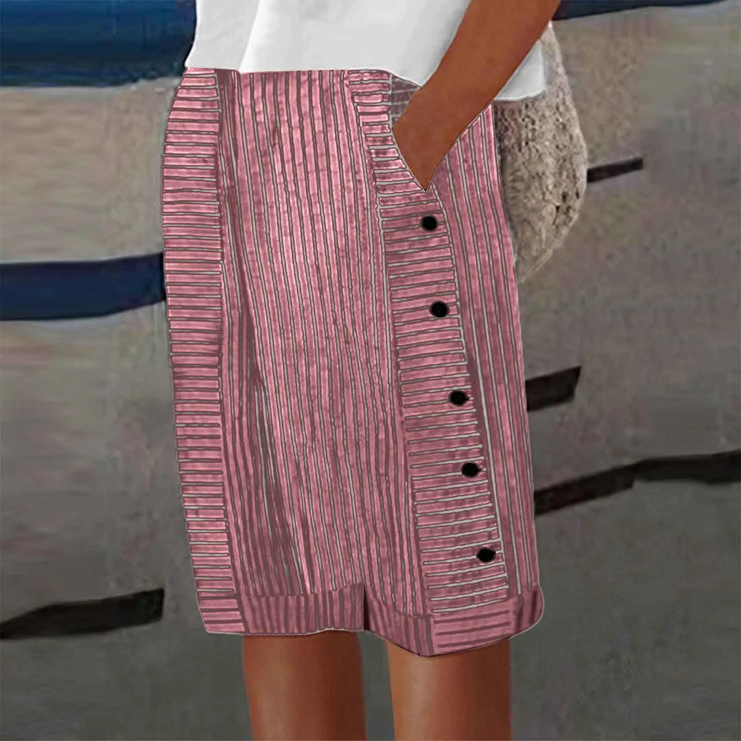 Women pink high waist striped shorts with decorative side button placket and cuffed hem.