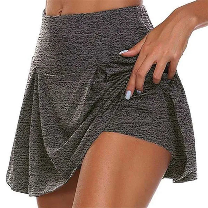 Women gray marl high waisted mini skirt with front pleats and integrated shorts sporty side view