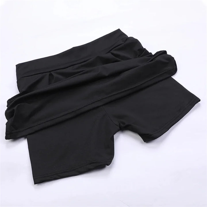 Women black high waisted mini skirt with integrated shorts laid flat revealing inner shorts