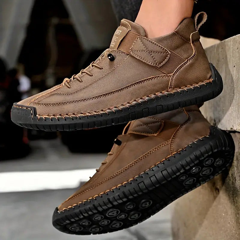 Close-up of men's brown lace-up platform sneakers with detailed stitched sole and textured bottom