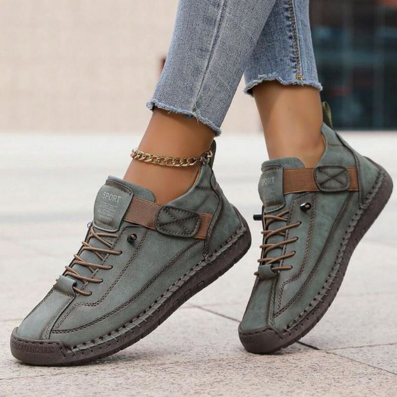 Women's green casual lace-up platform sneakers with visible side stitching and low-cut ankle design