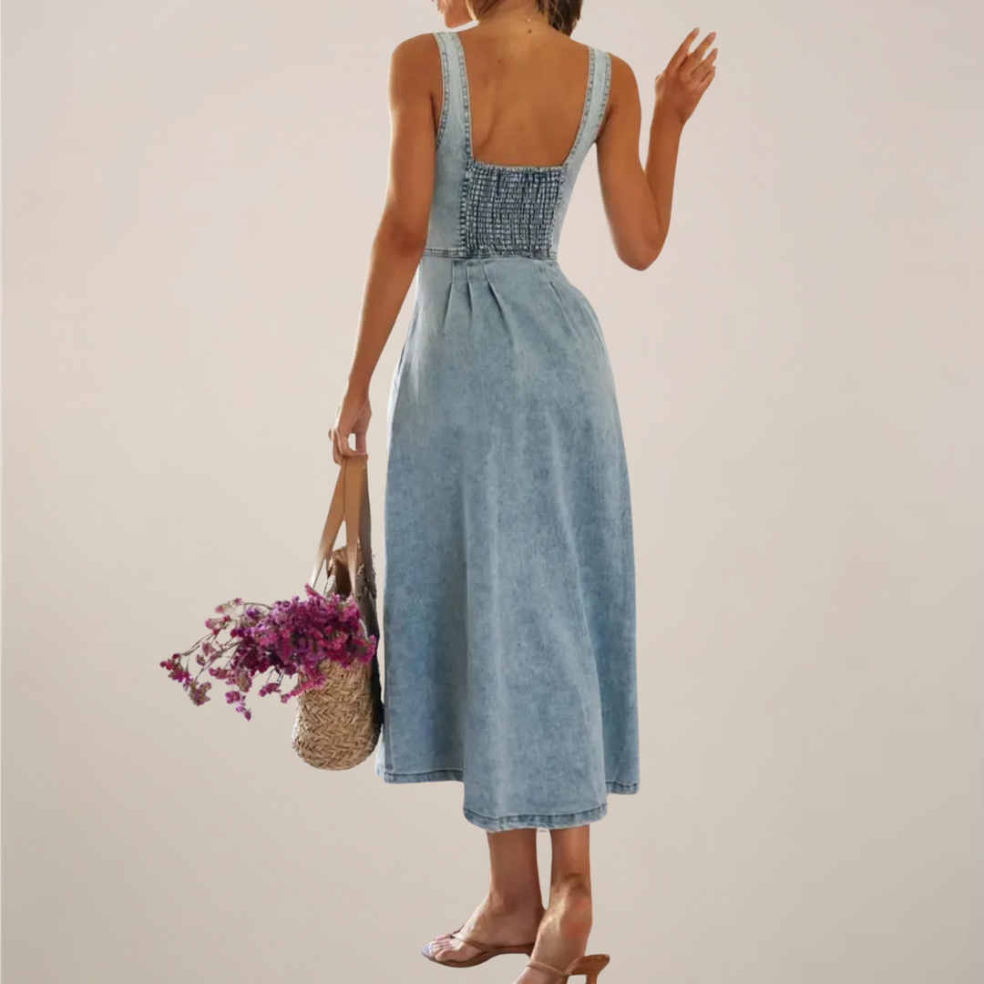 Women light blue sleeveless denim midi dress back view with smocked panel and shoulder straps