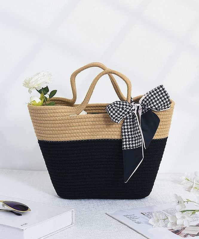 Women two-tone beige and black tote bag with houndstooth scarf, featuring an open top and interior.