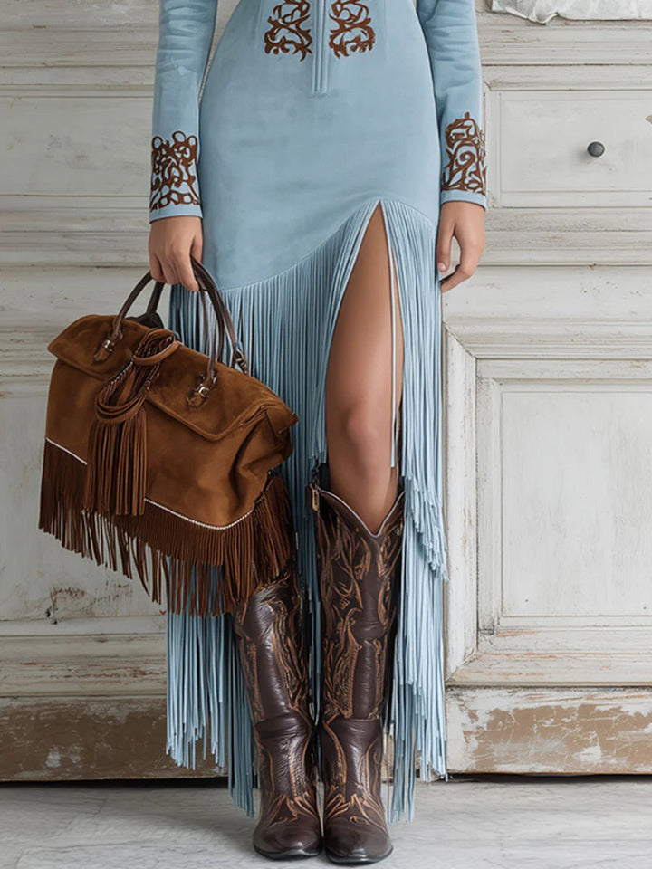 Women light blue long sleeve maxi dress showing high side slit and fringe details on hem