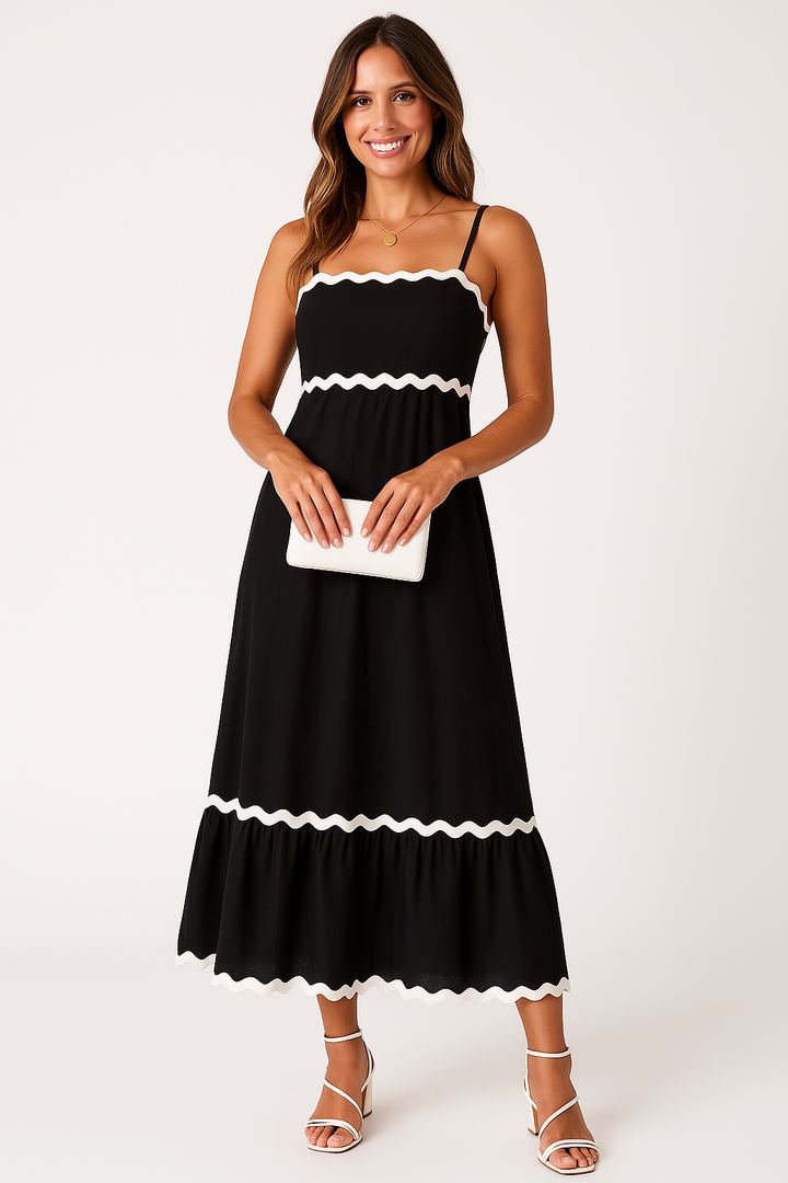 Women black A-line spaghetti strap maxi dress with white scalloped trim on neckline and hem, front view