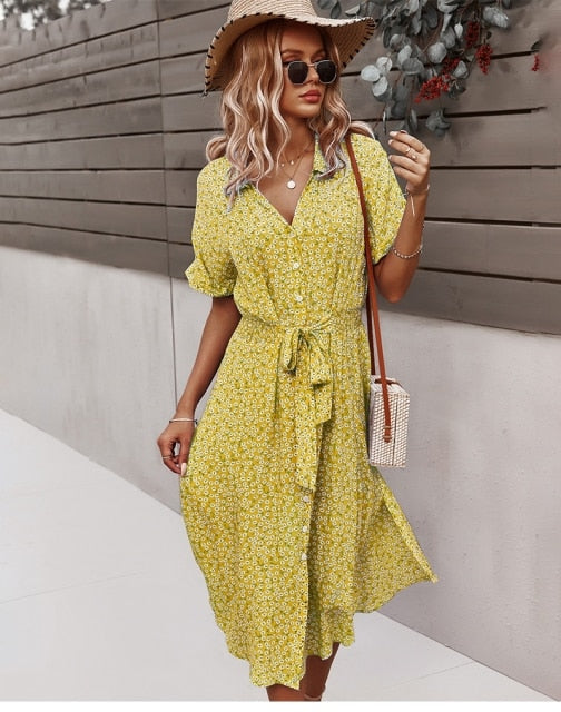 Women's yellow floral print midi dress with button-down front and cinched tie-waist detail