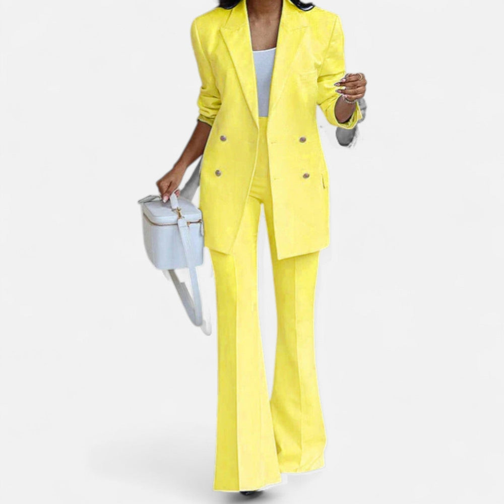 Women's yellow double breasted blazer and high waist flared pants set with lapel collar.