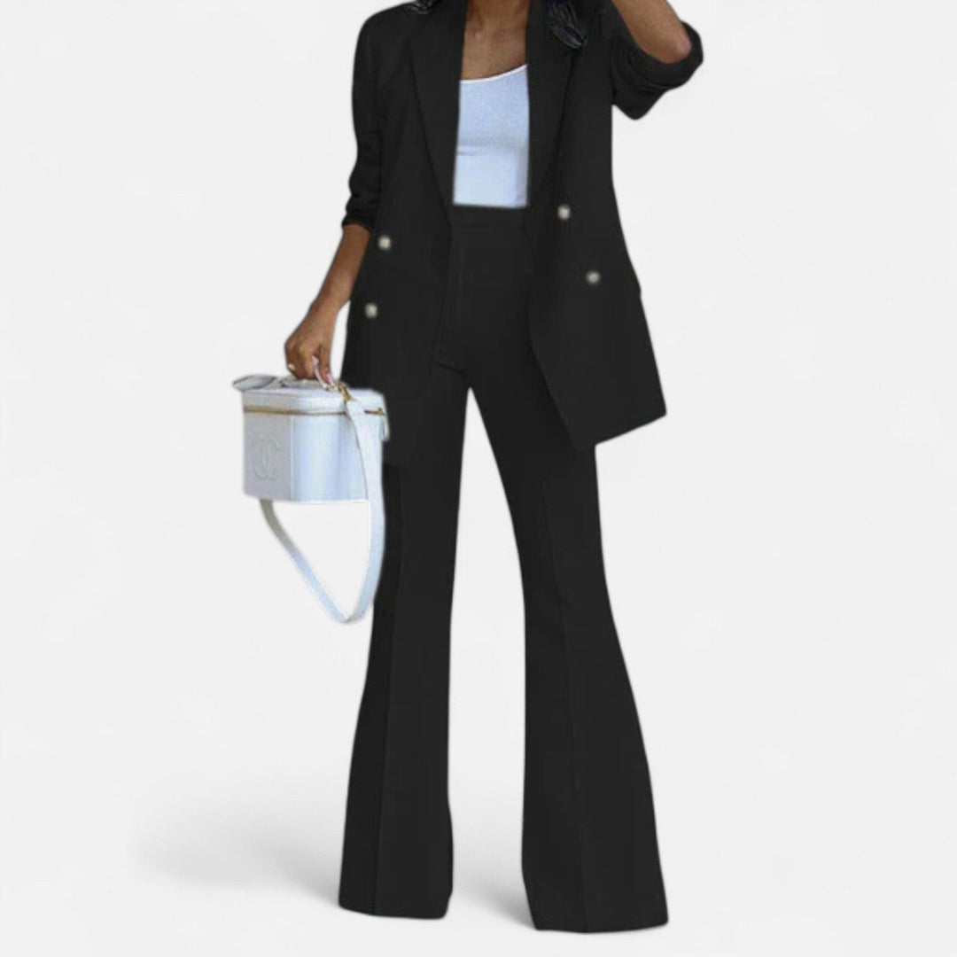 Women's black double breasted blazer and high waist flared pants set with gold buttons.