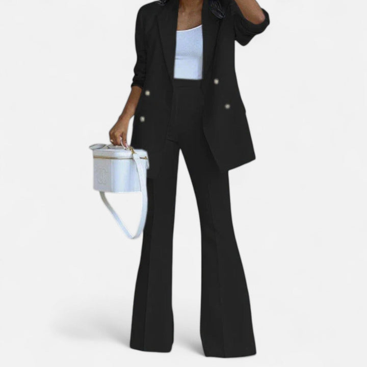 Women's black double breasted blazer and high waist flared pants set with gold buttons.