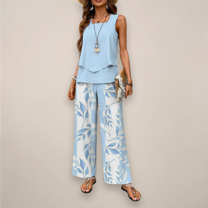 Women's light blue sleeveless top with white and blue leaf print wide leg pants