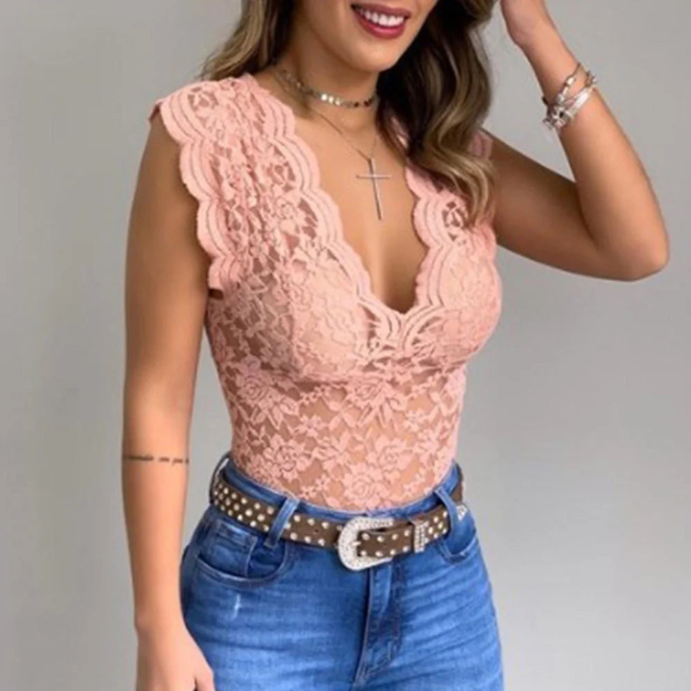Women pink floral lace bodysuit with deep V-neck and scalloped trim worn with jeans