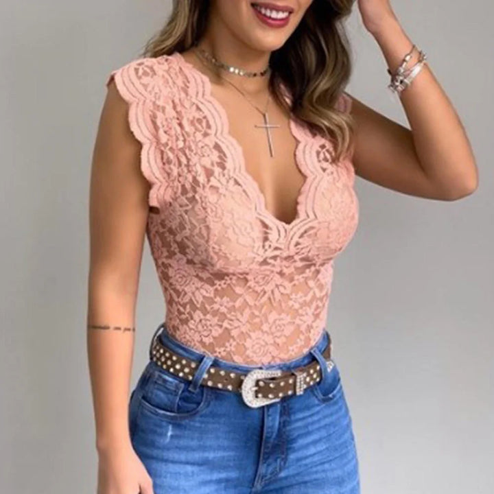 Women pink floral lace bodysuit with deep V-neck and scalloped trim worn with jeans