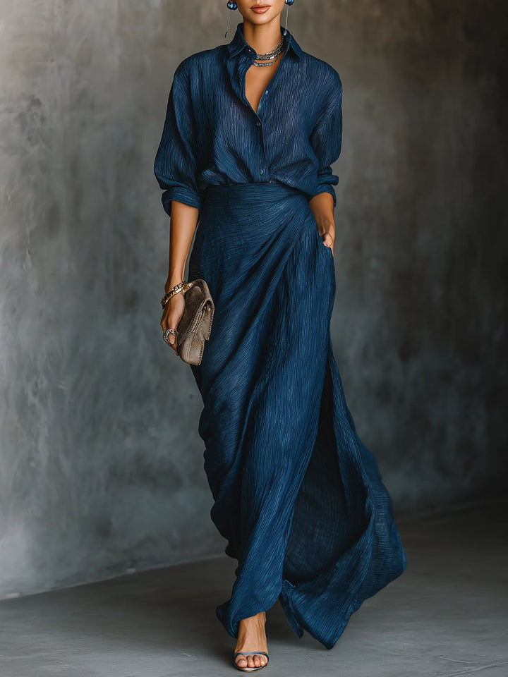 Women's navy crinkled button-down shirt and maxi skirt set, side view with hand in pocket