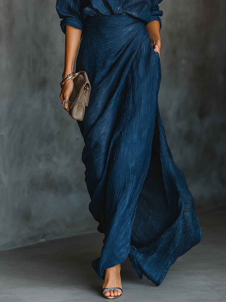 Women's navy crinkled maxi skirt with high slit and pocket, lower body view