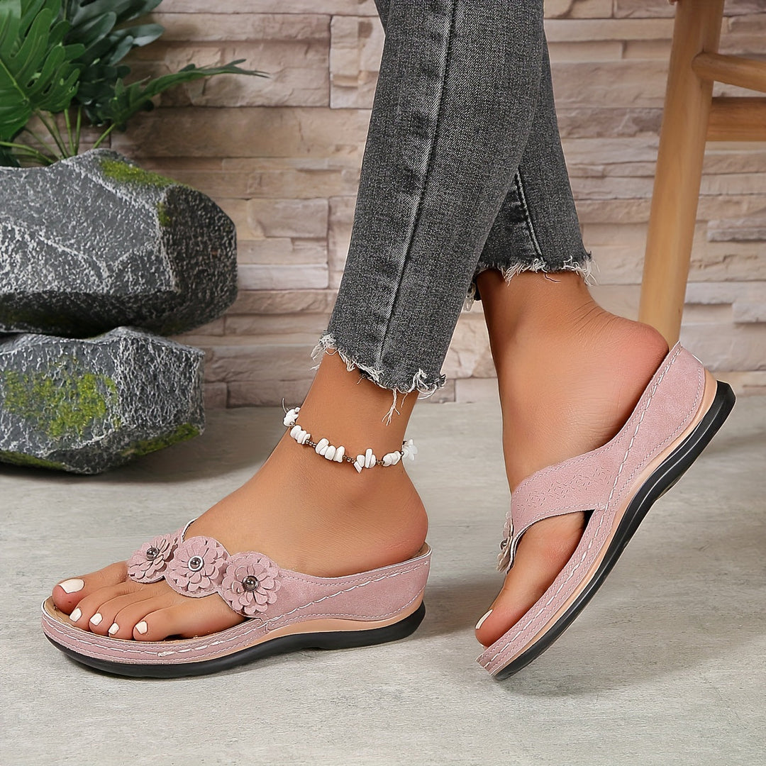 Women pink thong wedge sandals with three floral details and a comfortable contoured footbed