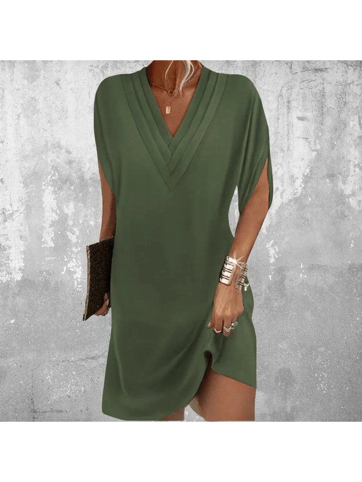 Women green V neck mini dress with short split sleeves and loose fit shown front view