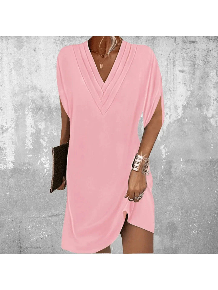 Women pink V neck mini dress featuring layered neckline and short split sleeves, front view