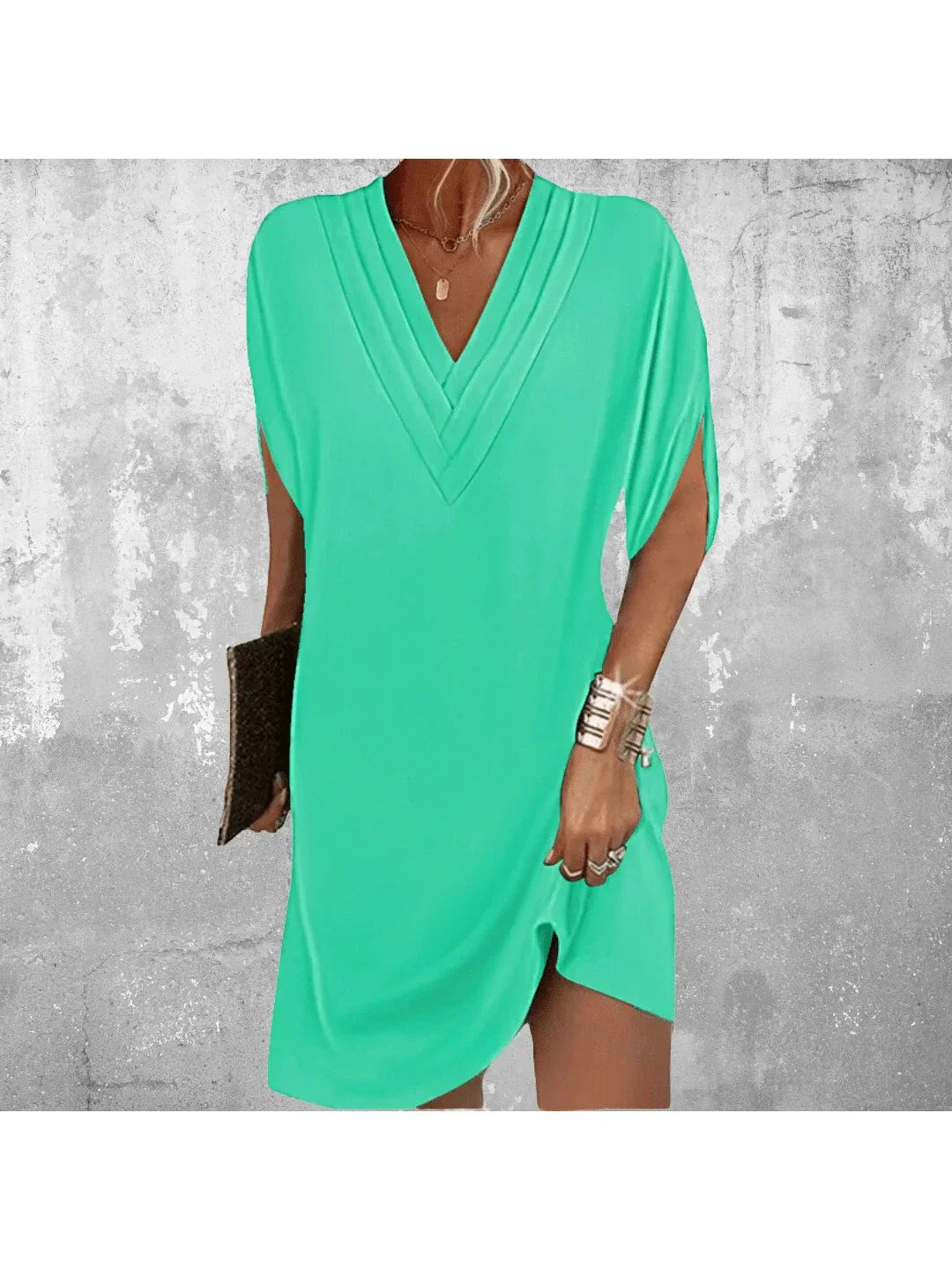 Women blue V neck mini dress with loose fit and above-knee hemline, showcasing sleeve splits