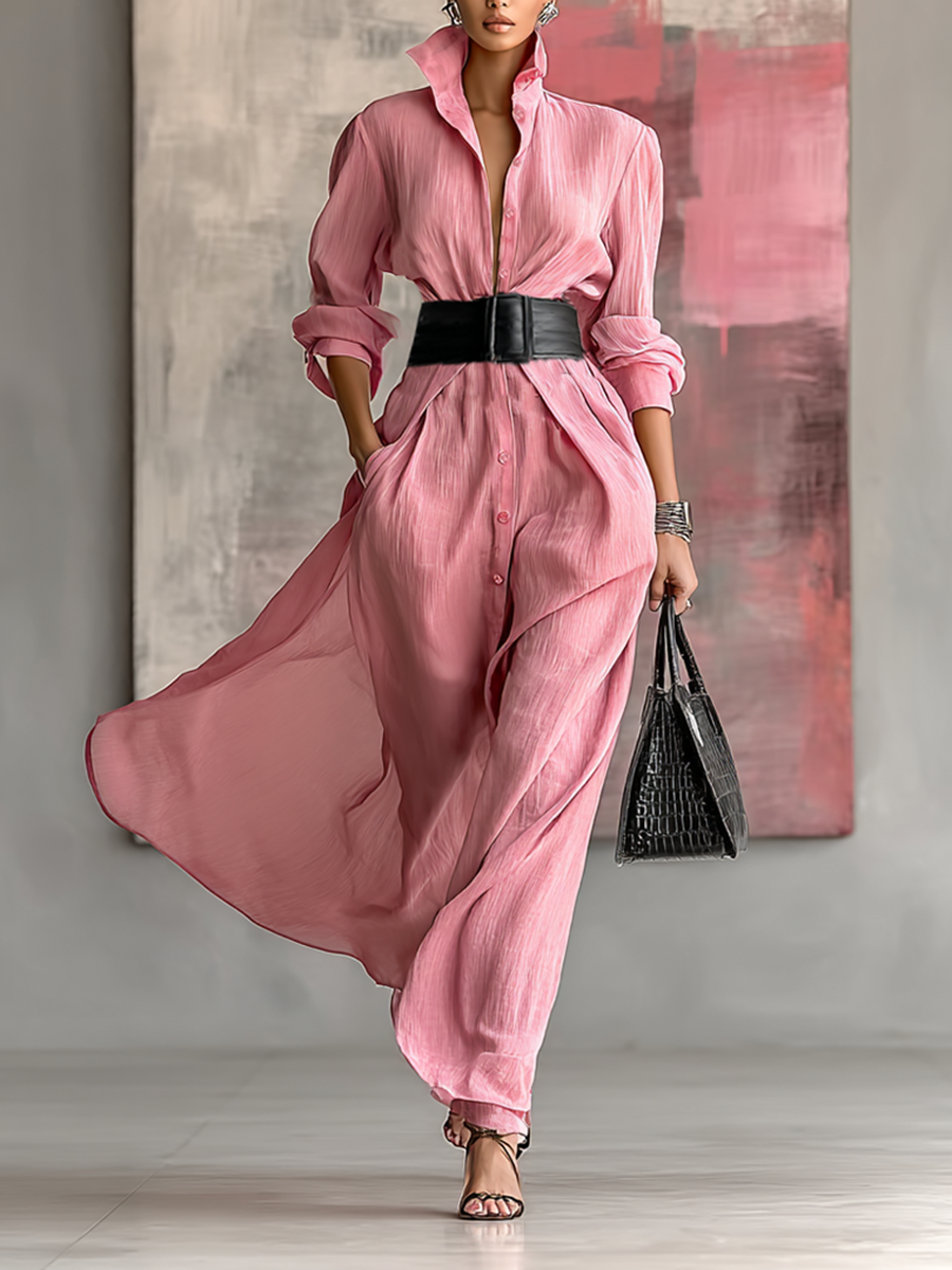 Women's pink collared maxi shirt dress with black belt and side pockets in front view