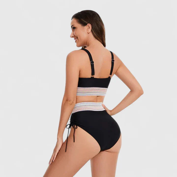 Black halter bikini back view showing strappy halter neck and striped band