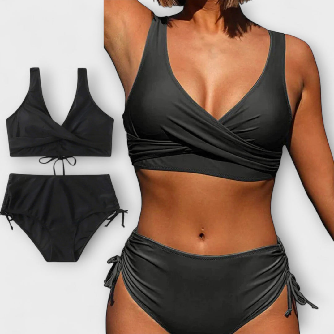 Black two-piece wrap bikini swimsuit with crossover top and tie-side bottoms