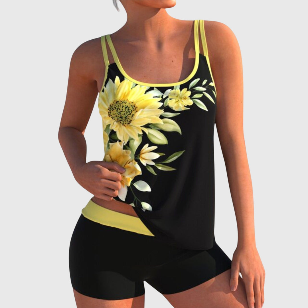 Black tankini swimsuit with yellow sunflower and daisy print and yellow trim with matching shorts