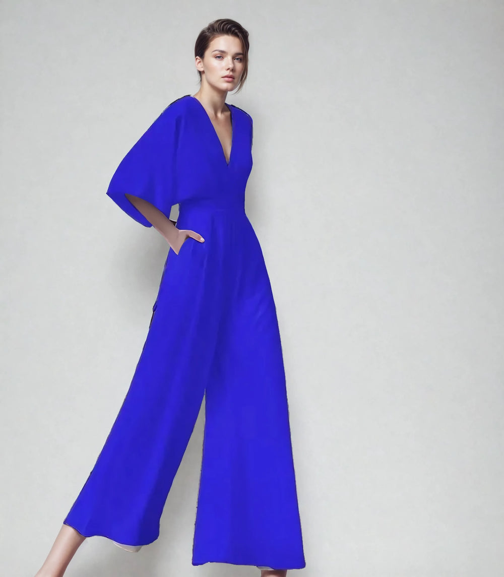 Women royal blue V neck butterfly sleeve wide leg jumpsuit with side pockets pose