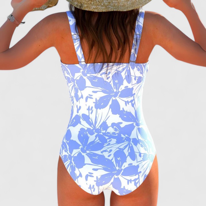 Blue and white floral print one-piece swimsuit back view with wrap detail