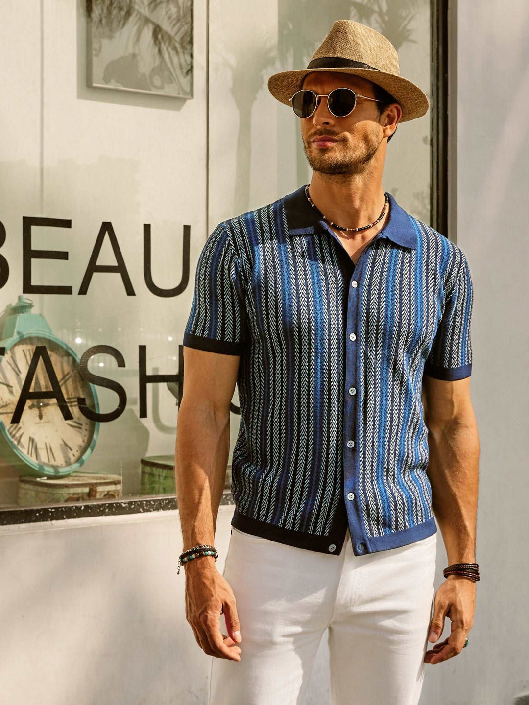 Blue striped short sleeve polo shirt with black contrast collar and cuffs