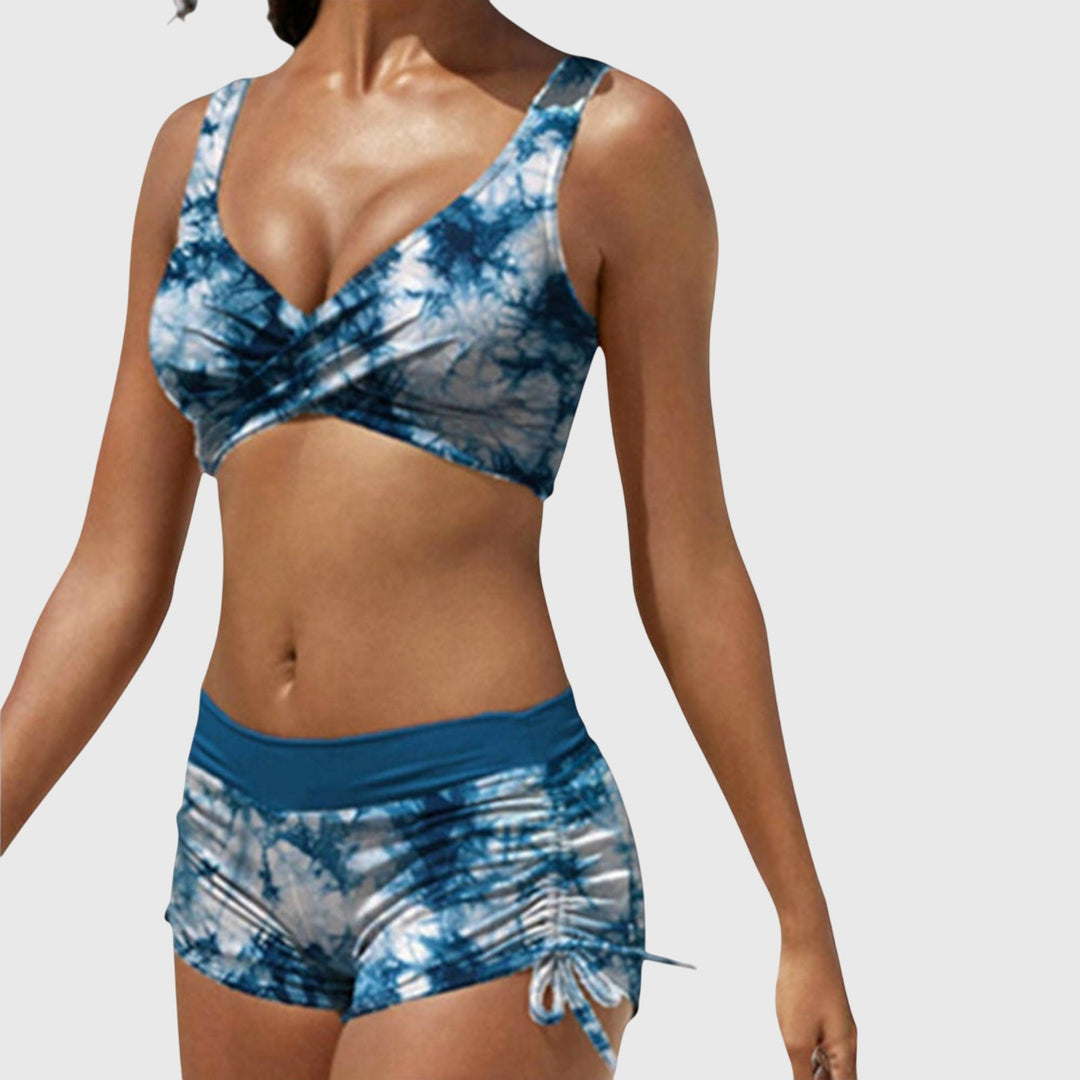 Blue tie-dye two-piece bikini with wrap-front top and ruched side-tie shorts