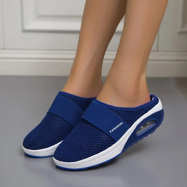 Women blue mesh slip-on mule walking shoes with white sole and visible air cushion