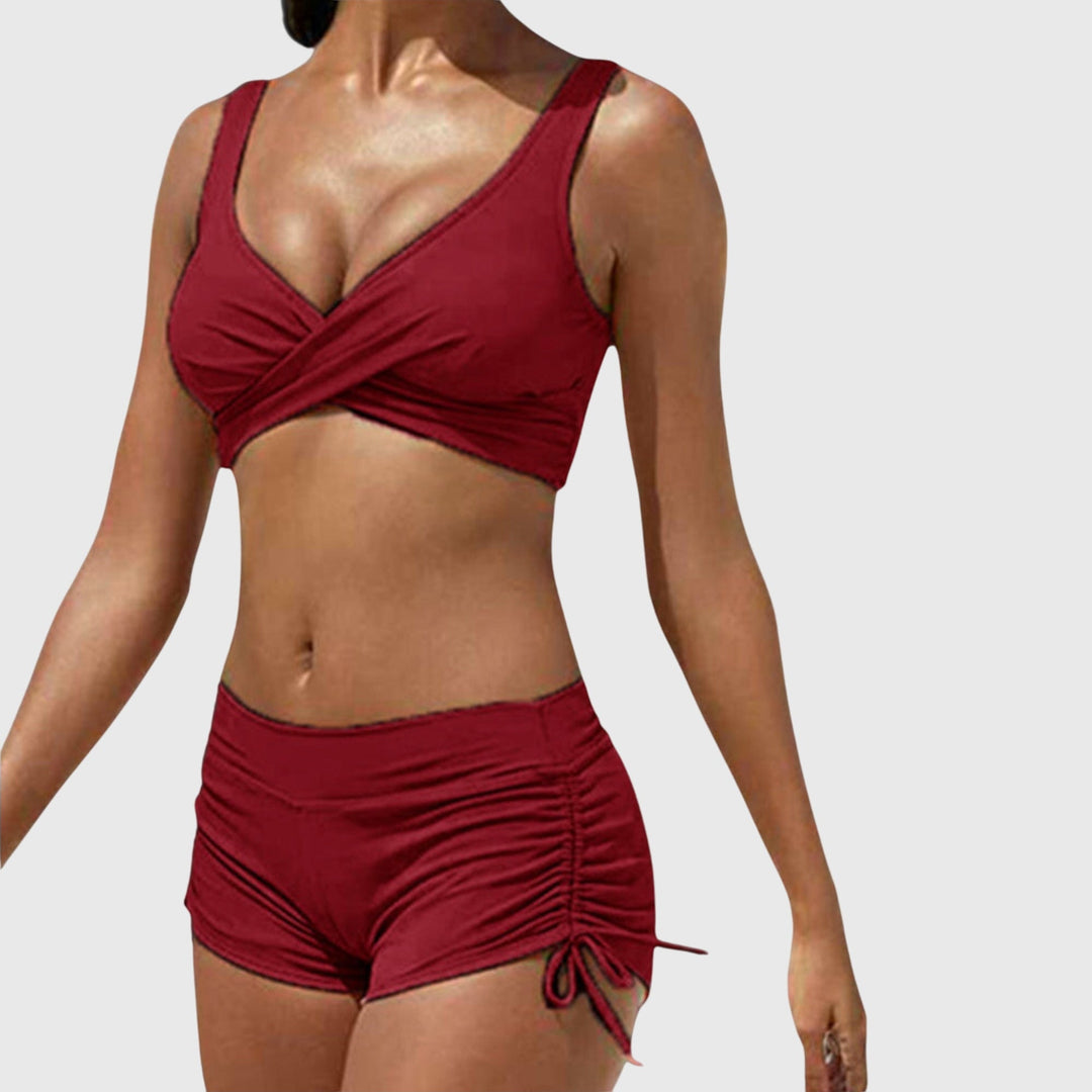 Burgundy two-piece bikini with wrap-front top and ruched side-tie shorts