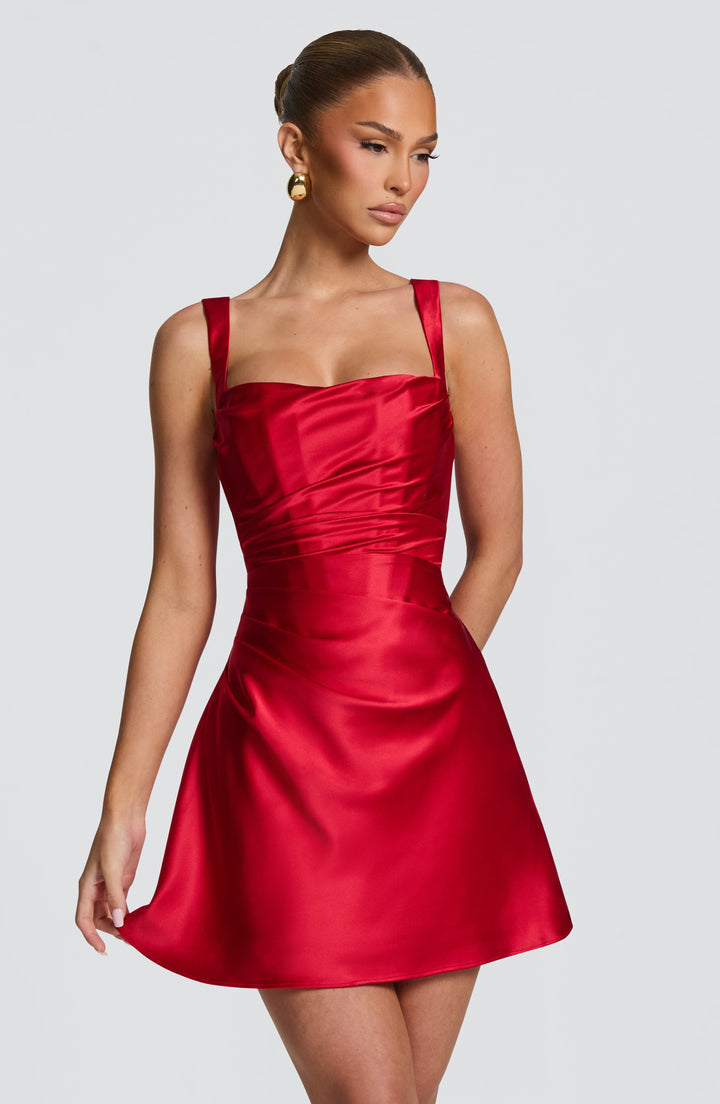 Women red mini dress with square neckline and ruched detail, side front view