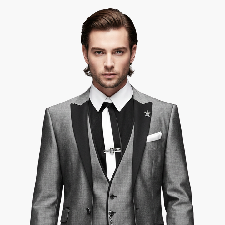 Charcoal gray blazer pocket detail with black trim and chain accent