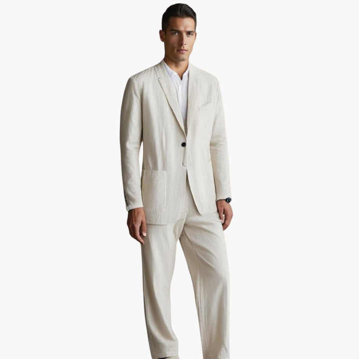 Man wearing cream linen suit with notch lapel blazer and straight pants
