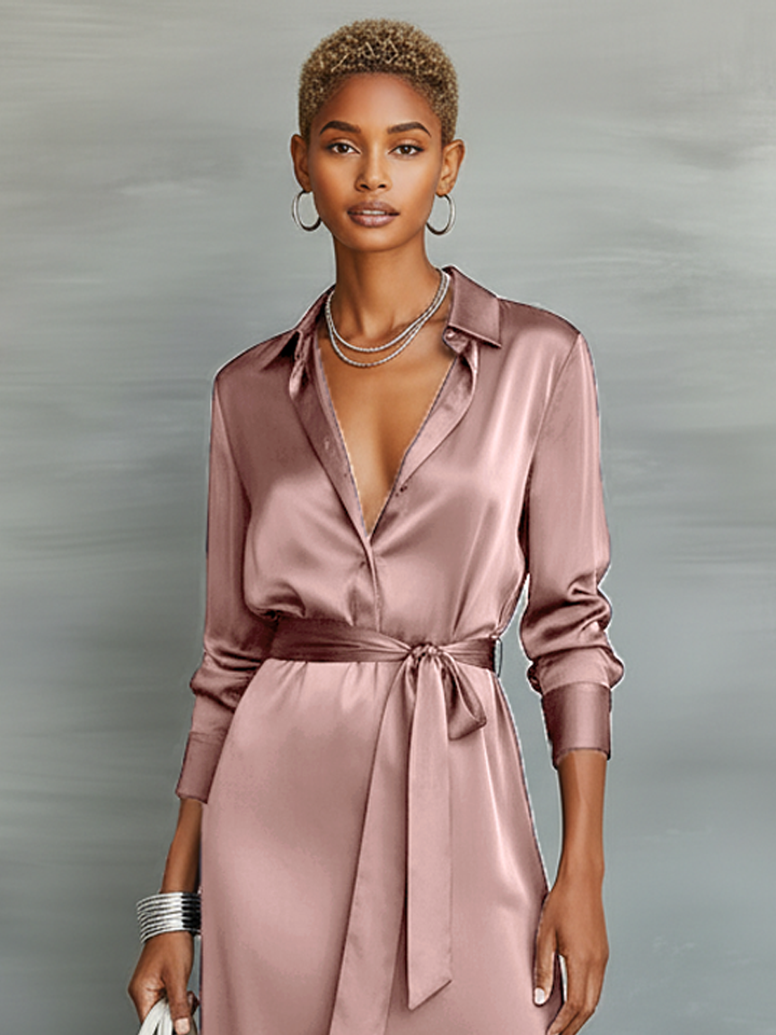 Women's mauve pink satin dress with collared neckline and tied belt, close up