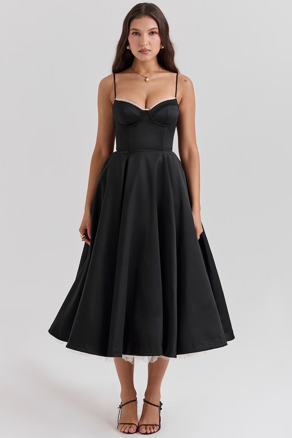 Women black bustier midi dress with lace trim, spaghetti straps and full midi skirt, front view.