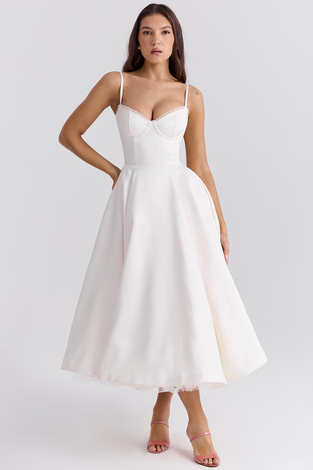 Women white bustier midi dress with lace detail, spaghetti straps, and full skirt, direct front.