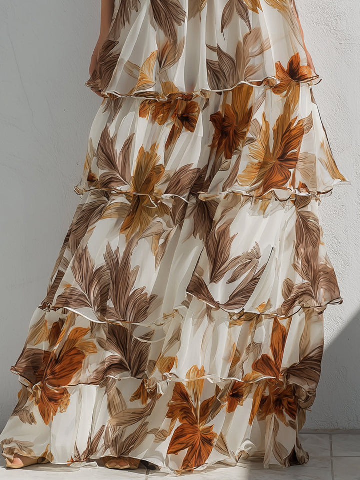 Women white floral tiered ruffle maxi dress close-up of the flowing skirt and ruffle detailing.