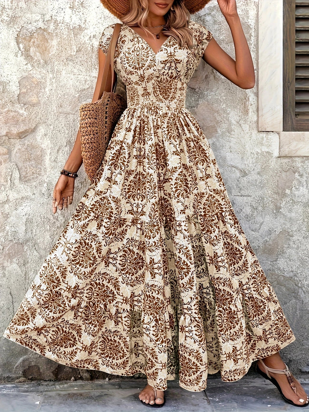 Women brown paisley print maxi dress with V-neck, short sleeves, shirred bodice, and ruffle hem