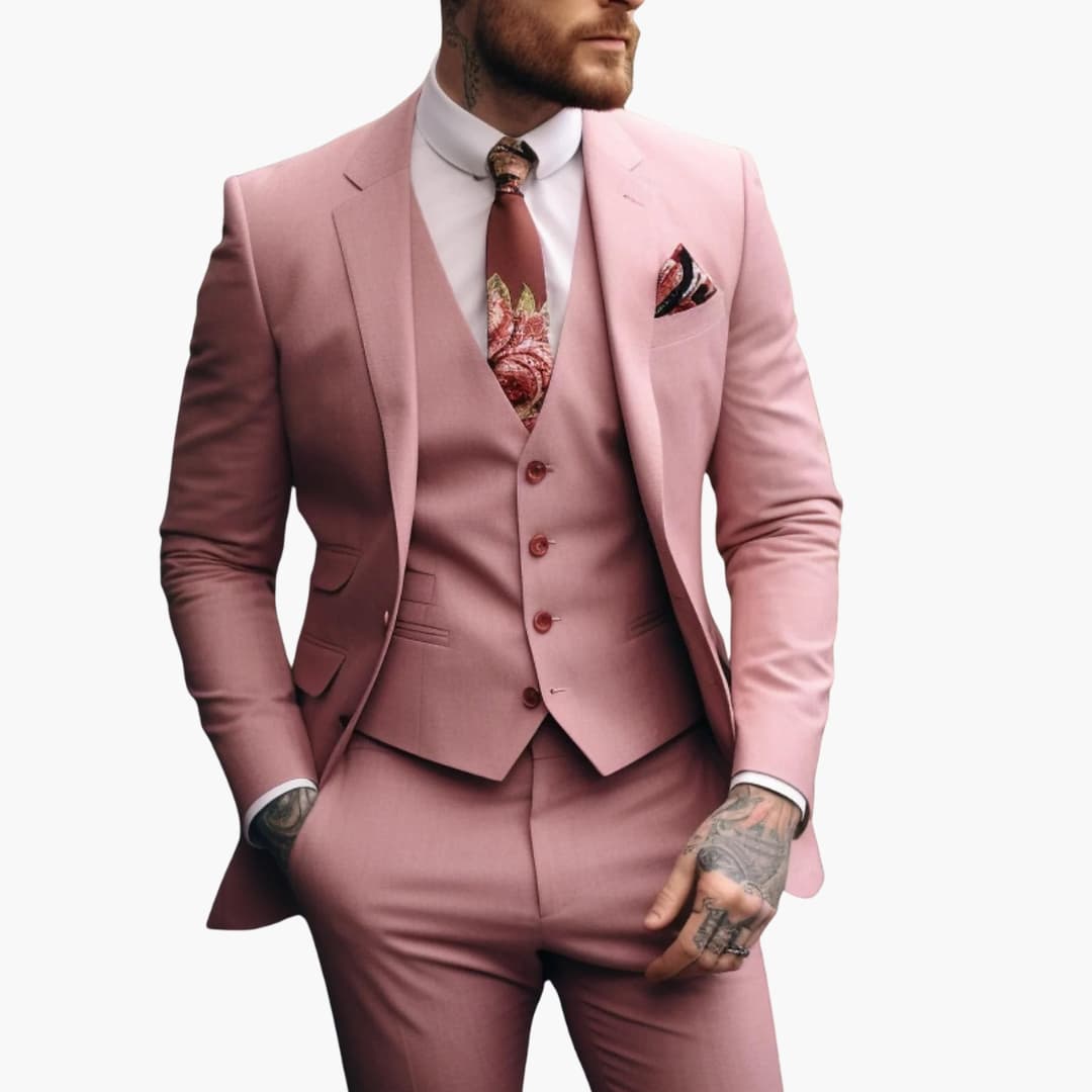Dusty rose three-piece formal suit with single-button blazer, matching vest, and patterned tie