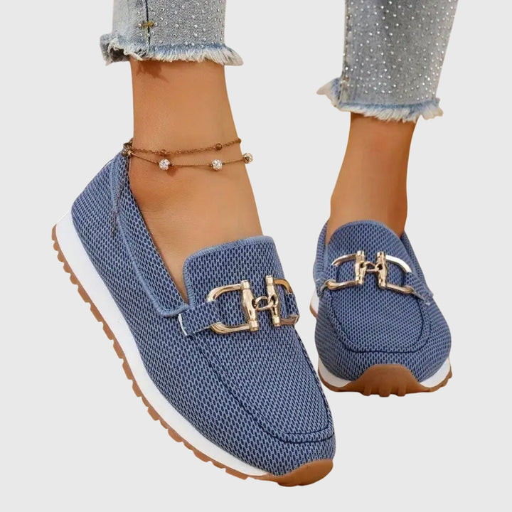 Women blue slip on buckle loafers with mesh upper and gold-toned buckle detail, front view