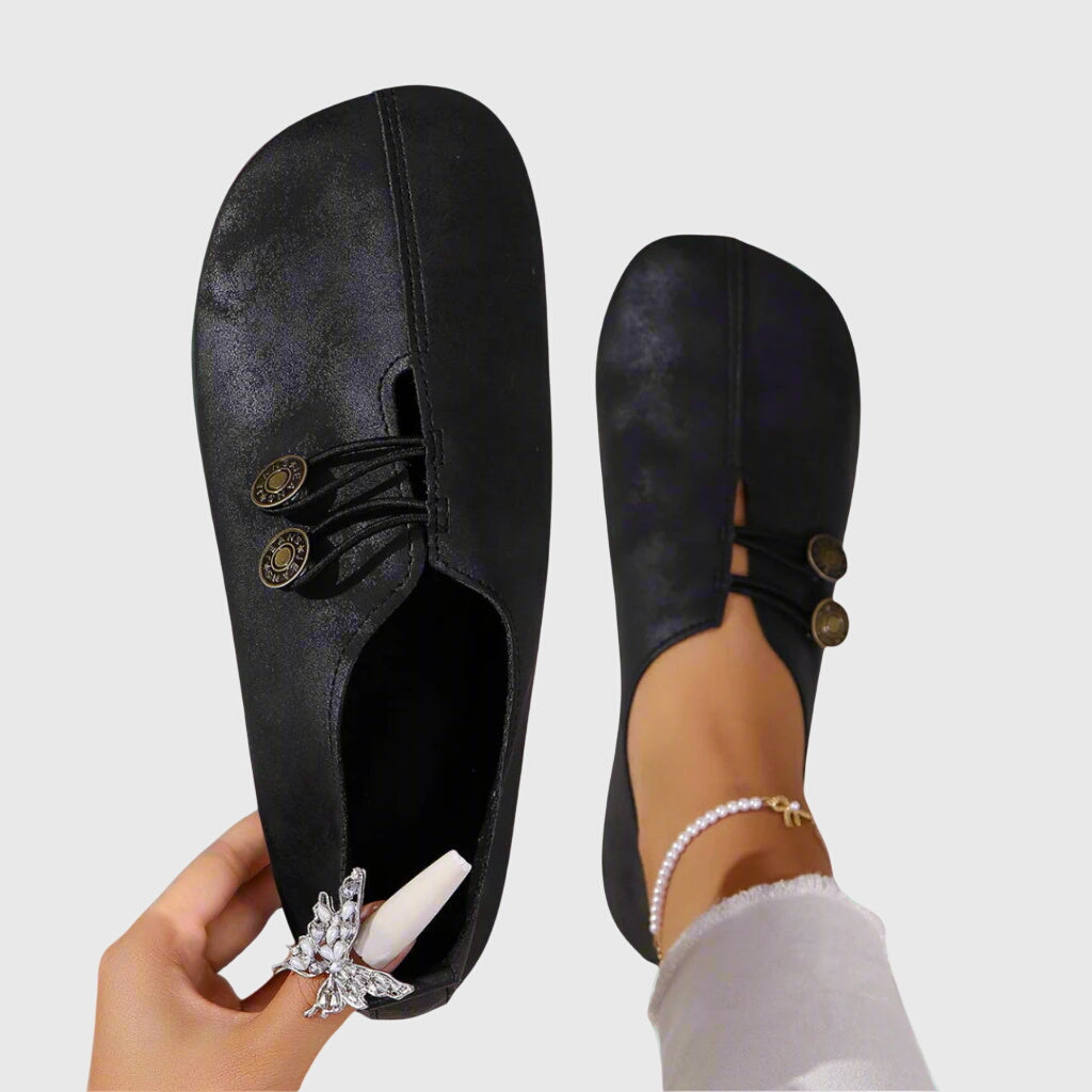 Women black slip on flats with three decorative buttons and elastic cords
