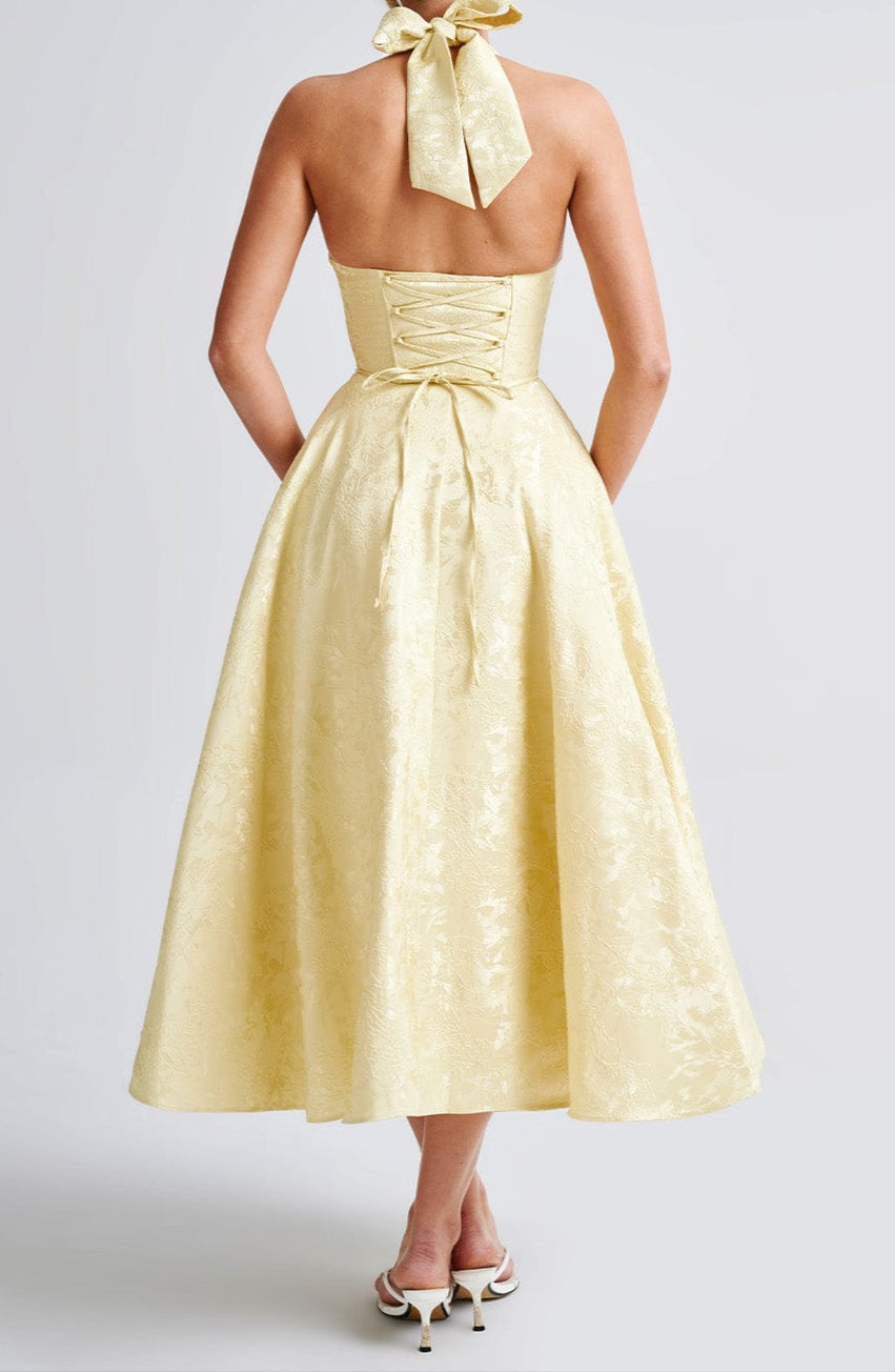 Women yellow floral jacquard midi dress, full back view showing halter and skirt volume