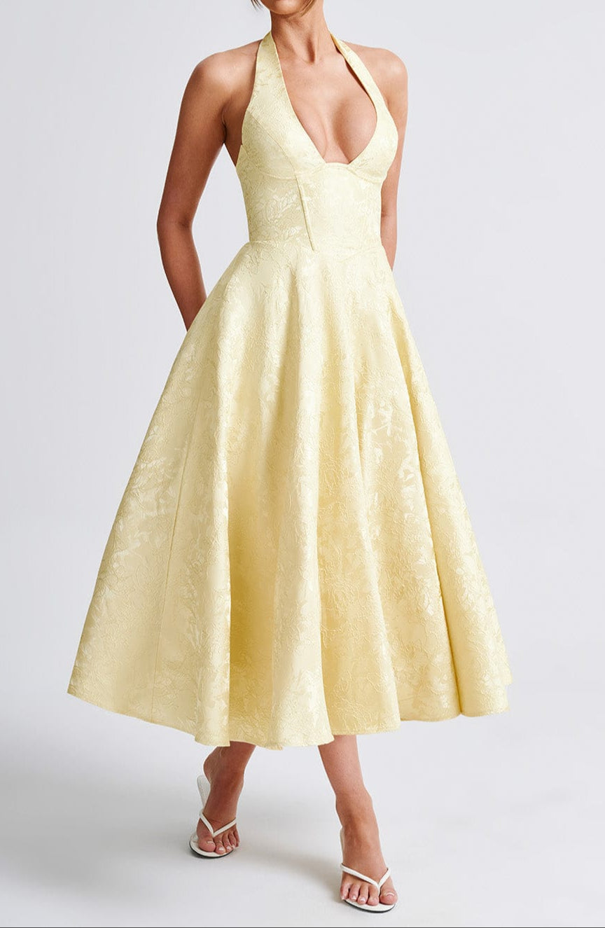Women yellow floral jacquard midi dress, plunge halter neckline, full skirt, angled view