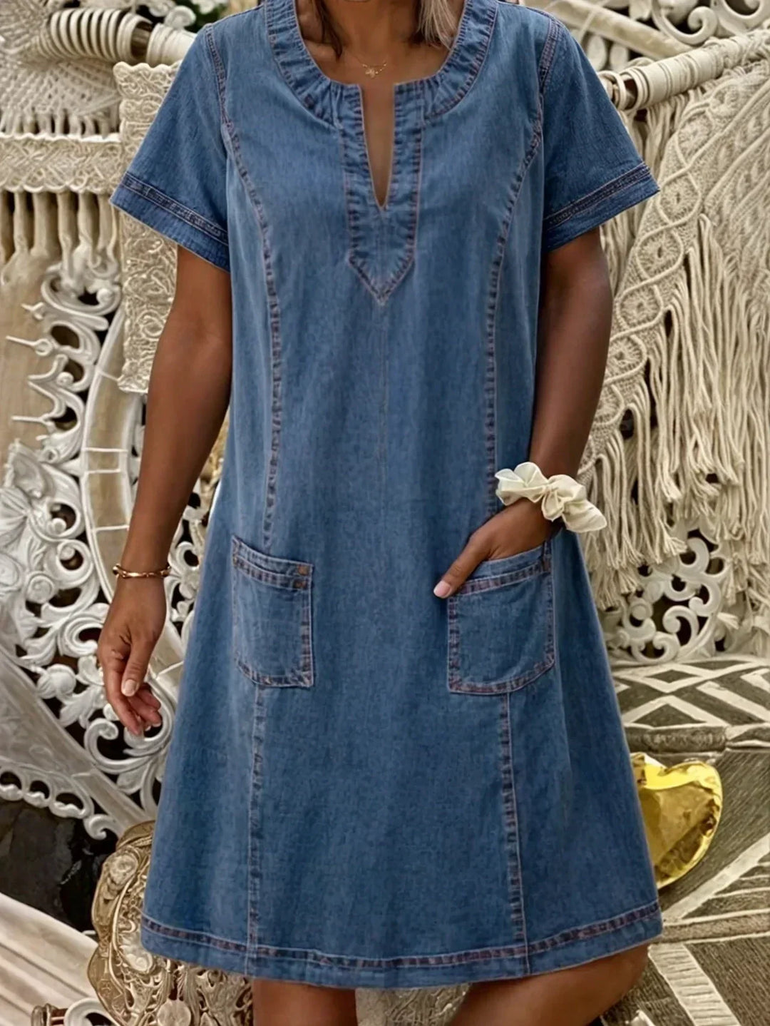 Women blue denim short sleeve midi dress with front patch pockets and v-neckline