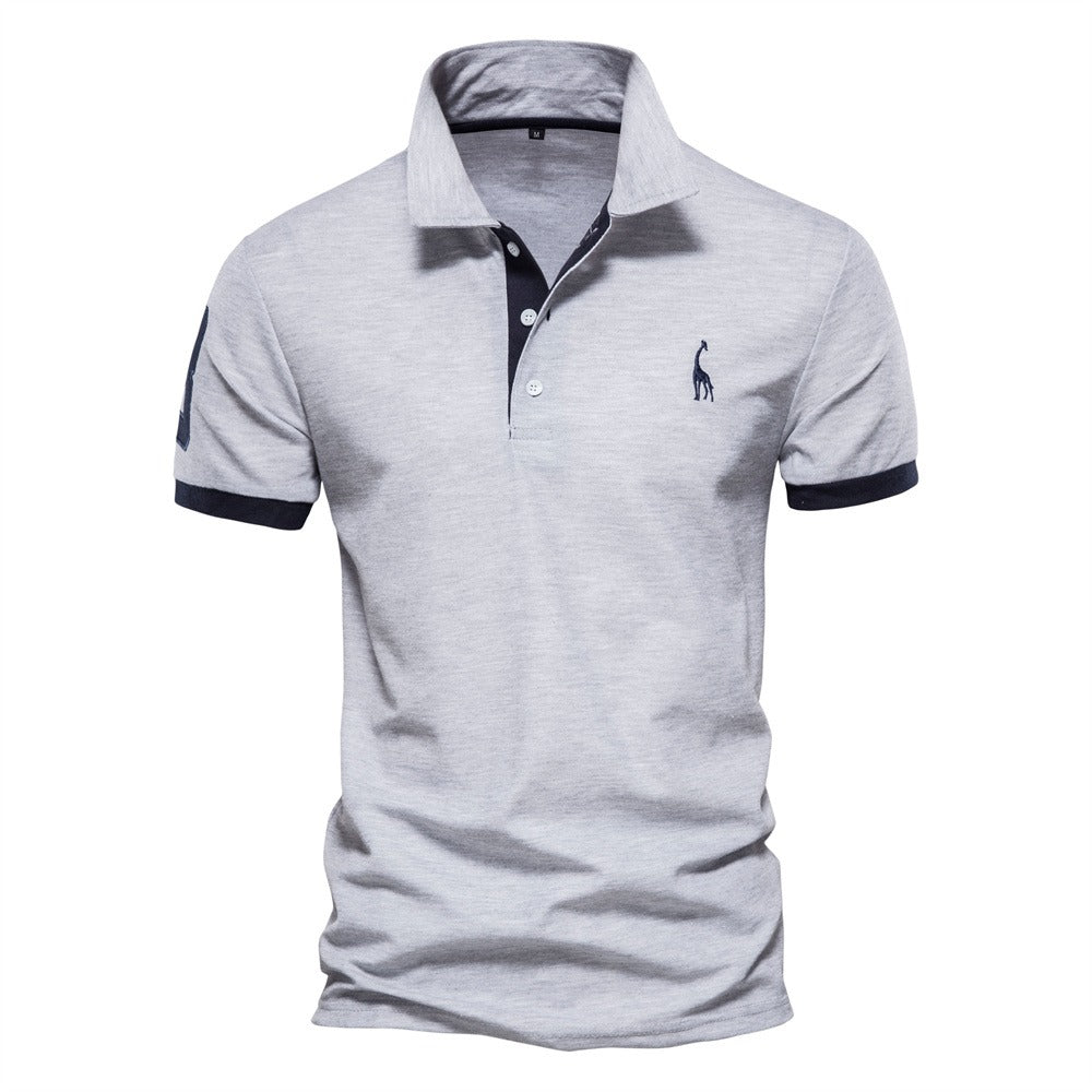 Light gray short-sleeved polo shirt with navy collar and sleeve trim